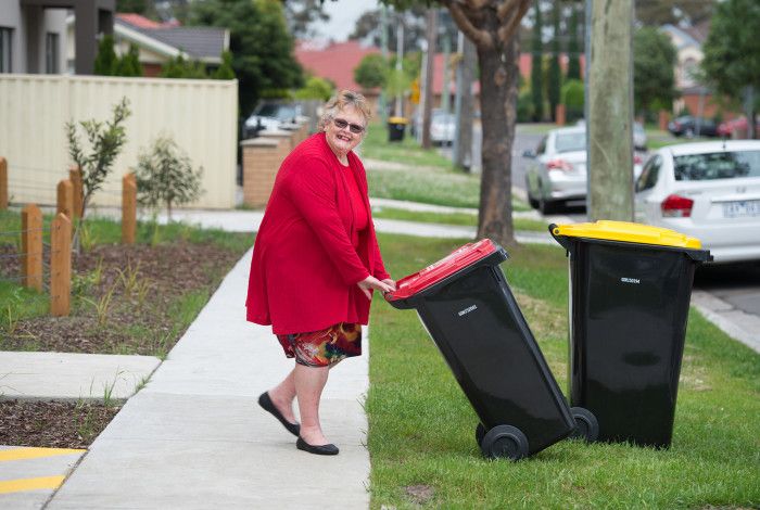 resident putting bin out